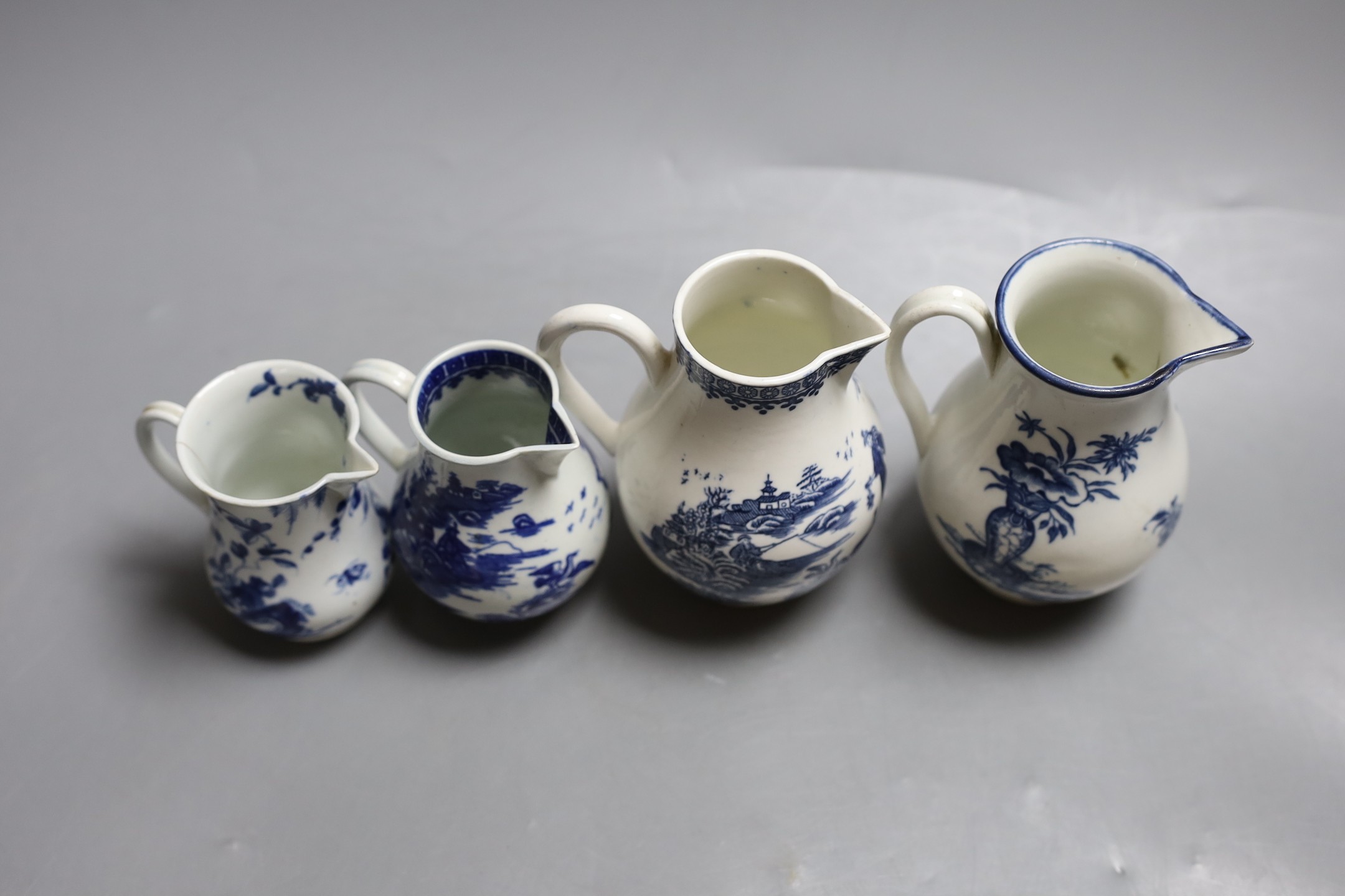 Four late 18th century Worcester blue and white sparrow beak jugs, tallest 12cm